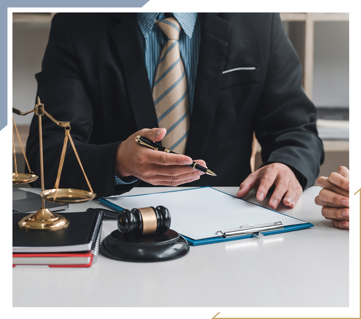 Lawyer discussing documents with client.