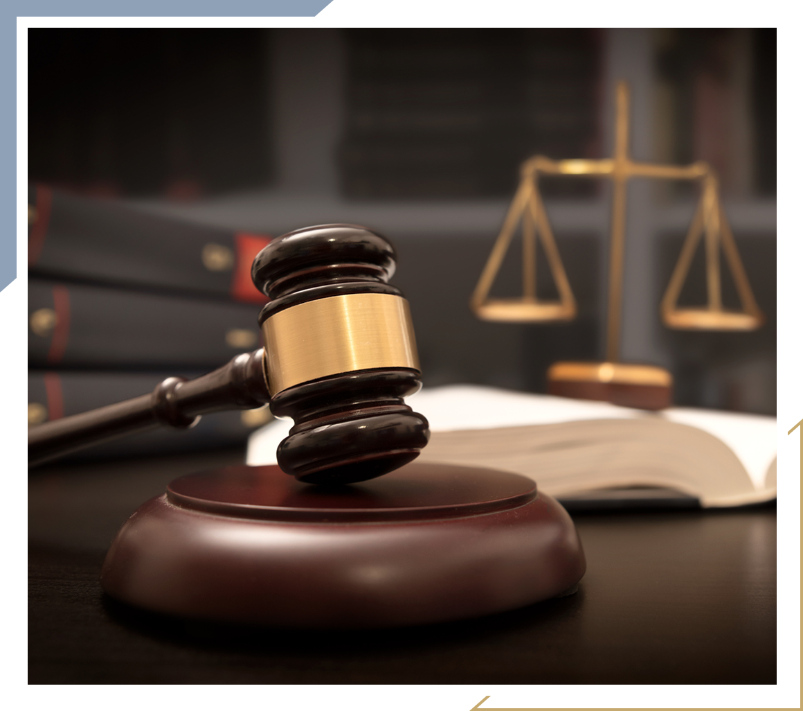 Gavel and scales of justice on desk.